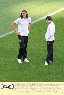 Football - UEFA Euro 2012 - England Training England s Andy Carroll shares a joke with Leighton Baines during their walk around at the Olympic Stadium, Kiev, Ukraine 