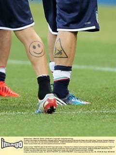 A smiley face tattoo of Alessandro Diamanti and a warning sign tattoo of Daniele De Rossi..Euro 2012 Italy Training, Olympic Stadium, Kiev, 23rd June 2012. Pic David Klein SPORTIMAGE... EDITORIAL USE ONLY. No use with unauthorised audio, video, data, fixture lists, club league logos or live services. Online in-match use limited to 120 images, no video emulation. No use in betting, games or single club league player publications.
