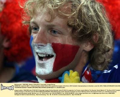 DONETSK, June 23, 2012 -- A fan for France reacts before the quarterfinal match at the Euro 2012 football championships in Donetsk, June 23, 2012. 