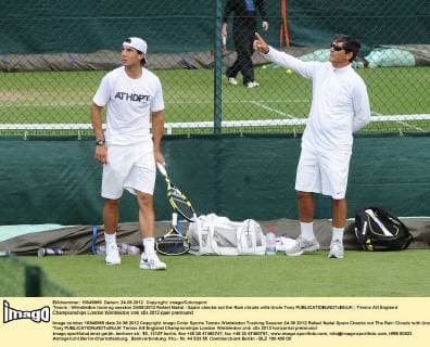 Tennis : Wimbledon training session 24 06 2012 Rafael Nadal - Spain checks out the Rain clouds with Uncle Tony 
