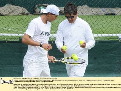 Tennis : Wimbledon training session 24 06 2012 Rafael Nadal - Spain checks out the tenis balls with Coach, Uncle Tony 