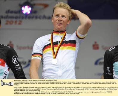 Fabian WEGMANN ( GER Garmin - Barracuda ) ist nach dem Sieg überglücklich - Podium - Meistertrikot - Siegerehrung - Jubel - Freude - Emotionen - quer - Event: Deutsche Meisterschaften - Strasse - Location: Grimma - Deutschland - Europa - Datum: 24.06.2012 - Contact