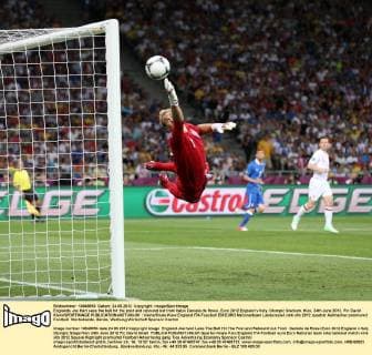 Englands Joe Hart sees the ball hit the post and rebound out from Italys Daniele de Rossi..Euro 2012 England v Italy, Olympic Stadium, Kiev, 24th June 2012. Pic David Klein SPORTIMAGE EDITORIAL USE ONLY. No use with unauthorised audio, video, data, fixture lists, club league logos or live services. Online in-match use limited to 120 images, no video emulation. No use in betting, games or single club league player publications.