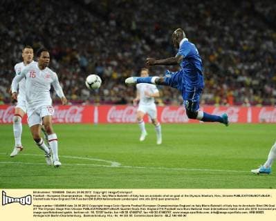 Football - European Championships - England vs. Italy Mario Balotelli of Italy has an acrobatic shot on goal at the Olympic Stadium, Kiev, Ukraine 