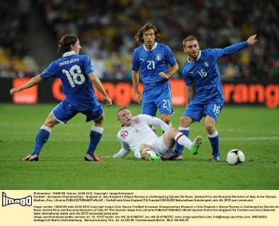 Football - European Championships - England vs. Italy England s Wayne Rooney is challenged by Daniele De Rossi, Andrea Pirlo and Riccardo Montolivo of Italy at the Olympic Stadium, Kiev, Ukraine 