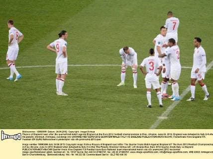 Players of England react after the quarterfinal match against England at the Euro 2012 football championships in Kiev, Ukraine, June 24, 2012. England was defeated by Italy 2-4 after the penalty shootout. (Xinhua Li Jundong) (lm) UKRAINE-KIEV-EURO 2012-QUARTERFINALS-ITALY VS ENGLAND 