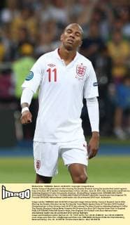 Ashley Young of England reacts after missing his penalty shootout during the quarterfinal match against Italy at the Euro 2012 football championships in Kiev, Ukraine, June 24, 2012. Italy entered the semifinals by defeating England 4-2 after the penalty shootout. (Xinhua Meng Yongmin) (kh) UKRAINE-KIEV-EURO 2012-QUARTERFINALS-ITALY VS ENGLAND 