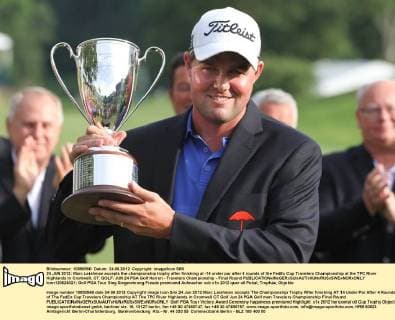 24 JUN 2012: Marc Leishman accepts the championship trophy after finishing at -14 under par after 4 rounds of the FedEx Cup Travelers Championship at the TPC River Highlands in Cromwell, CT. GOLF: JUN 24 PGA Golf Herren - Travelers Championship - Final Round Icon120624021 EDITORIAL USE ONLY
