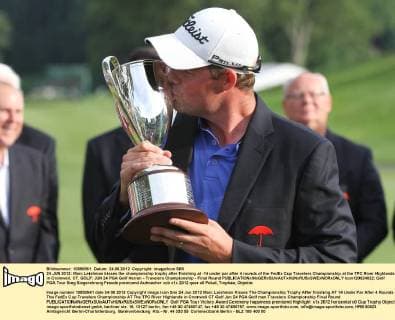 24 JUN 2012: Marc Leishman kisses the championship trophy after finishing at -14 under par after 4 rounds of the FedEx Cup Travelers Championship at the TPC River Highlands in Cromwell, CT. GOLF: JUN 24 PGA Golf Herren - Travelers Championship - Final Round Icon120624022 EDITORIAL USE ONLY