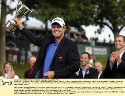 June 24, 2012 - Cromwell, CT, USA - Marc Leishman hoists the trophy of the 2012 Travelers Championship golf tournament at the TPC River Highlands in Cromwell, Connecticut, Sunday, June 24, 2012. Final Round - ZUMAm67