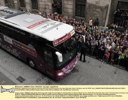 England s national soccer players board an Euro 2012 official bus as they leave the team hotel in Krakow June 25, 2012. lemi_120625 