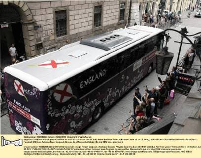England s national soccer players board an Euro 2012 official bus as they leave the team hotel in Krakow June 25, 2012. lemi_120625 