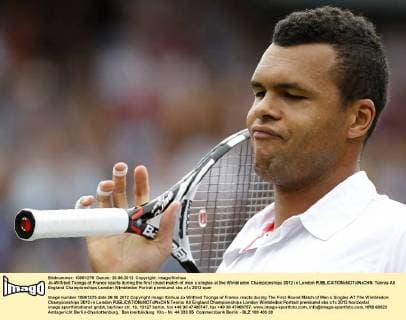 Jo-Wilfried Tsonga of France reacts during the first round match of men s singles at the Wimbledon Championships 2012 in London 