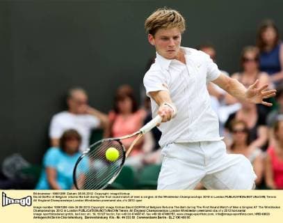 David Goffin of Belgium returns the ball during the first round match of men s singles at the Wimbledon Championships 2012 in London 