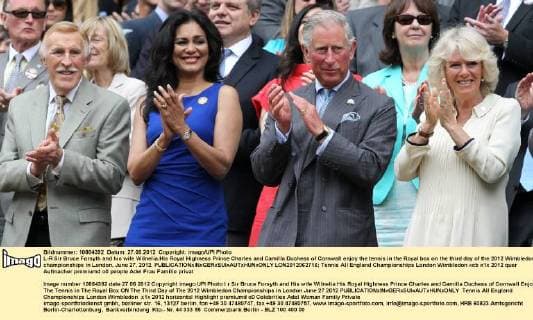 L-R Sir Bruce Forsyth and his wife Wilnelia,His Royal Highness Prince Charles and Camilla Duchess of Cornwall enjoy the tennis in the Royal box on the third day of the 2012 Wimbledon championships in London, June 27, 2012.  LON2012062716