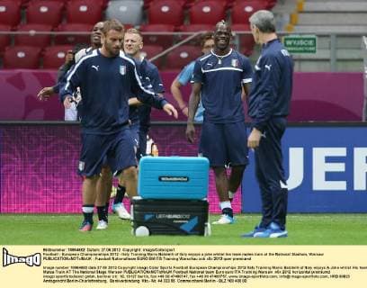 Football - European Championships 2012 - Italy Training Mario Balotelli of Italy enjoys a joke whilst his team mates train at the National Stadium, Warsaw 