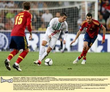 FUSSBALL - EURO 2012, POR vs ESP DONETSK,UKRAINE,27.JUN.12 - FUSSBALL - UEFA Europameisterschaft 2012 in Polen und der Ukraine, Halbfinale, Portugal vs Spanien. Bild zeigt Sergio Ramos (ESP), Cristiano Ronaldo (POR) und Sergio Busquets (ESP). 