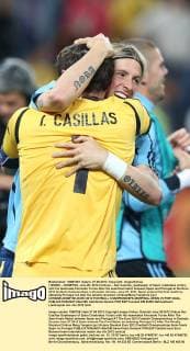(120628) -- DONETSK, June 28, 2012 (Xinhua) -- Iker Casillas, goalkeeper of Spain celebrates victory with his teammate Fernando Torres after the semifinal match between Spain and Portugal at the Euro 2012 football championships in Donetsk, Ukraine, June 27, 2012. Spain entered the final match by defeating Portugal 4-2 after the penalty shootout. (Xinhua Meng Yongmin) (jyc) UKRAINE-DONETSK-EURO 2012 FOOTBALL CHAMPIONSHIPS-SEMIFINAL-SPAIN VS PORTUGAL 