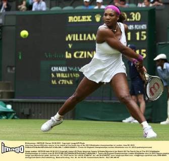 American Serena Williams returns in her match on the fourth day of the 2012 Wimbledon championships in London, June 28, 2012.  LON2012062811