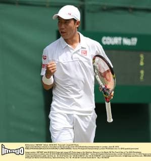 Japan s Kei Nishikori returns in his match on the fourth day of the 2012 Wimbledon championships in London, June 28, 2012.  LON2012062822