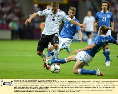 The Euro 2012 football championships semi-final match Germany vs. Italy on June 28, 2012 at the National Arena in Warsaw, Poland. Lukas Podolski, Federico Balzaretti Claudio Marchisio  EN_01035922_0024