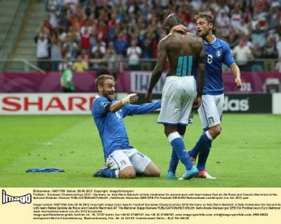 Football - European Championships 2012 - Germany vs. Italy Mario Balotelli of Italy celebrates his second goal with team mates Daniele De Rossi and Claudio Marchisio at the National Stadium, Warsaw 