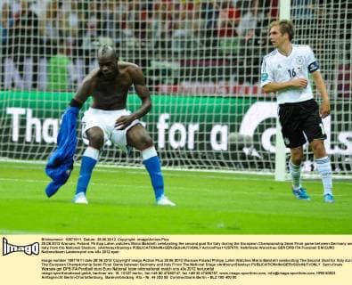 28.06.2012 Warsaw, Poland. Philipp Lahm watches Mario Balotelli celebrating the second goal for Italy during the European Championship Semi Final game between Germany and Italy from the National Stadium. xAnthonyxStanleyx  ActionPlus11297070