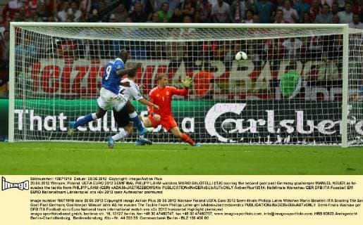 28.06.2012 Warsaw, Poland. UEFA EURO 2012 SEMIFINAL PHILIPP LAHM watches MARIO BALOTELLI (ITA) scoring the second goal past Germany goalkeeper MANUEL NEUER as he evades the tackle from PHILIPP LAHM (GER) xADAMxJASTRZEBOWSKIx  ActionPlus18314