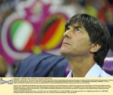 WARSAW, June 28, 2012 -- Germany s head coach Joachim Löw reacts before the semifinal match between Germany and Italy at the Euro 2012 football championships in Warsaw, Poland, June 28, 2012. Italy won 2-1 to enter the final. (Xinhua Ma Ning) (jyc) POLAND-WARSAW-EURO 2012 FOOTBALL CHAMPIONSHIPS-SEMIFINAL-GERMANY VS ITALY 