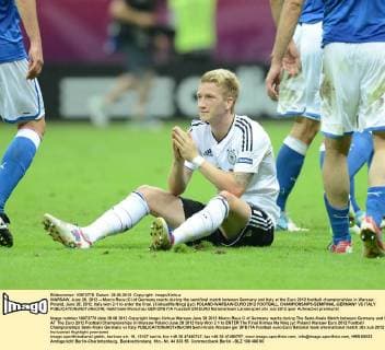WARSAW, June 28, 2012 -- Marco Reus (C) of Germany reacts during the semifinal match between Germany and Italy at the Euro 2012 football championships in Warsaw, Poland, June 28, 2012. Italy won 2-1 to enter the final. (Xinhua Ma Ning) (jyc) POLAND-WARSAW-EURO 2012 FOOTBALL CHAMPIONSHIPS-SEMIFINAL-GERMANY VS ITALY 