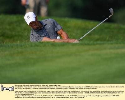June 28, 2012 - Tiger Woods hits his third shot out of a bunker on the sixteenth hole during first round play at the AT&T National at Congressional Country Club in Bethesda MD. Golf 2012: AT&T National First Round JUN 28 - ZUMAcjm