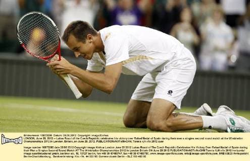 LONDON, June 28, 2012 -- Lukas Rosol of the Czech Republic celebrates his victory over Rafael Nadal of Spain during their men s singles second round match at the Wimbledon Championships 2012 in London, Britain, on June 28, 2012. 