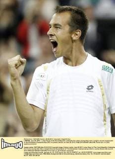LONDON, June 28, 2012 -- Lukas Rosol of the Czech Republic celebrates his victory during their men s singles second round match at the Wimbledon Championships 2012 in London, Britain, on June 28, 2012. 