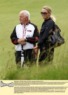 28.06.2012. County Antrim, Northern Ireland. Rory McIlroy s tennis star girlfriend Caroline Wozniacki (right) watching with Gerry McIlroy during the first round of the Irish Open at his hometown course of Royal Portrush in County Antrim, Northern Ireland xianxbinesx  ActionPlus20132850