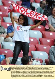 Polish model Natalia Siwiec, the hottest girl of Euro 2012 shows a T-shirt that reads at the front Bad Boy Cambell and at the back BBC is to mock former international Sol Campbell’s comments about the dangers of travelling to Poland and Ukraine, during The Euro 2012 football championships semi-final match Germany vs. Italy on June 28, 2012 at the National Arena in Warsaw, Poland.  EN_01035924_0003