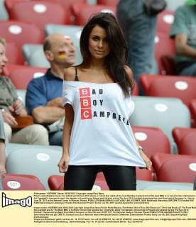 Polish model Natalia Siwiec, the hottest girl of Euro 2012 shows a T-shirt that reads at the front Bad Boy Cambell and at the back BBC is to mock former international Sol Campbell’s comments about the dangers of travelling to Poland and Ukraine, during The Euro 2012 football championships semi-final match Germany vs. Italy on June 28, 2012 at the National Arena in Warsaw, Poland.  EN_01035975_0009