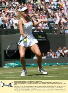 Russian Maria Sharapova returns in her on the fifth day of the 2012 Wimbledon championships in London, June 29, 2012.  LON2012062904
