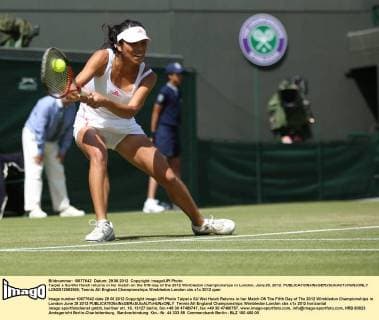 Taipei s Su-Wei Hsieh returns in her match on the fifth day of the 2012 Wimbledon championships in London, June 29, 2012.  LON2012062909