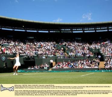 Russian Maria Sharapova serves in her match on the fifth day of the 2012 Wimbledon championships in London, June 29, 2012.  LON2012062902