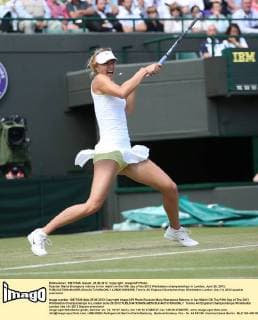 Russian Maria Sharapova returns in her match on the fifth day of the 2012 Wimbledon championships in London, June 29, 2012.  LON2012062905