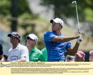 June 29, 2012 - Washington, District of Columbia, U.S. - TIGER WOODS hits his tee shot on the par-3 seventh hole at Congressional CC in Bethesda, MD. during the second round of the AT&T National. Woods shot a 3-under 68 to be within 3 shots of the lead with others still on the course. AT&T National Second Round - ZUMAmv2