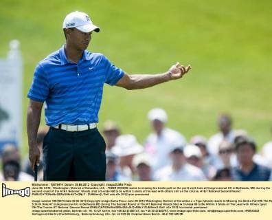 June 29, 2012 - Washington, District of Columbia, U.S. - TIGER WOODS reacts to missing his birdie putt on the par-5 sixth hole at Congressional CC in Bethesda, MD. during the second round of the AT&T National. Woods shot a 3-under 68 to be within 3 shots of the lead with others still on the course. AT&T National Second Round - ZUMAmv2