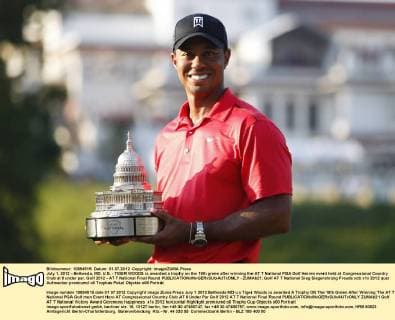 July 1, 2012 - Bethesda, MD, U.S. - TIGER WOODS is awarded a trophy on the 18th green after winning the AT T National PGA Golf Herren event held at Congressional Country Club at 8 under par. Golf 2012 - AT T National Final Round - ZUMAb21