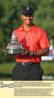 JULY 01, 2012 - Tiger Woods holds the trophy after winning and passing Jack Nicklaus by winning his 74th tournament at the AT T National at Congressional Country Club in Bethesda MD. Golf 2012: AT T National JUL 01 - ZUMAcjm