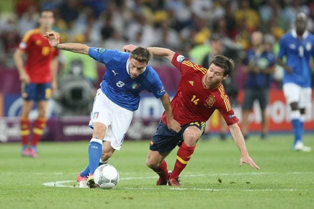 Football - European Championships 2012 Final - Spain vs. Italy Claudio Marchisio of Italy and Xabi Alonso of Spain at the Olympic Stadium, Kiev 