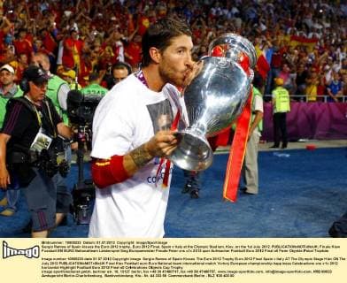 Sergio Ramos of Spain kisses the Euro 2012 trophy..Euro 2012 Final, Spain v Italy at the Olympic Stadium, Kiev, on the 1st July 2012. EDITORIAL USE ONLY. No use with unauthorised audio, video, data, fixture lists, club league logos or live services. Online in-match use limited to 120 images, no video emulation. No use in betting, games or single club league player publications.