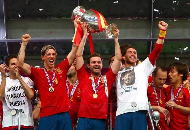 Fernando Torres, Juan Mata and Sergio Ramos of Spain lift the Euro 2012 trophy..Euro 2012 Final, Spain v Italy at the Olympic Stadium, Kiev, on the 1st July 2012. EDITORIAL USE ONLY. No use with unauthorised audio, video, data, fixture lists, club league logos or live services. Online in-match use limited to 120 images, no video emulation. No use in betting, games or single club league player publications.