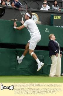 Wimbledon Week 2; Tennis Championships 2012 03 07 2012 David Ferrer v Juan Martin Del Potro Del Potro clashes into the canvas wall at the back of the court 