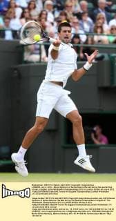 LONDON, July 4, 2012 -- Novak Djokovic of Serbia returns the ball during the quarterfinal of men s singles at the Wimbledon Championships 2012 in London, Britain on July 4, 2012. 