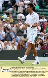 LONDON, July 4, 2012 -- Novak Djokovic of Serbia celebrates after the quarterfinal of men s singles at the Wimbledon Championships 2012 in London, Britain on July 4, 2012. 